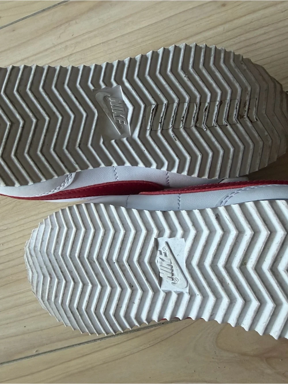 Nike Kids White Sneakers with Red Swoosh